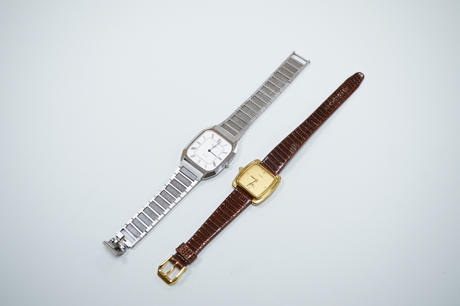 A gentleman's recent stainless steel backed Longines quartz wrist watch, with Roman dial, case diameter 31mm, on a steel bracelet, together with a lady's steel and gold plated Longines quartz wrist watch, case diameter 2